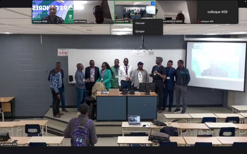 Session du colloque 409 en format hybride, avec des intervenants à distance affichés sur l’écran de la salle